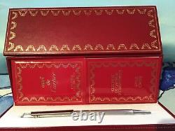 Cartier ball point Stylo Bille in silver and gold colour with Cartier red trim