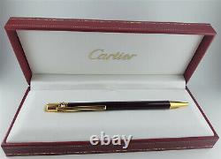 Cartier ballpoint pen, burgundy colour. Trinity collection. Boxed