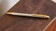 Cartier Must Santos Ballpoint Pen Silver With Gold Trim & Accents