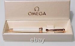 Omega cream & rose gold pen with free Omega handbag charm in original boxes